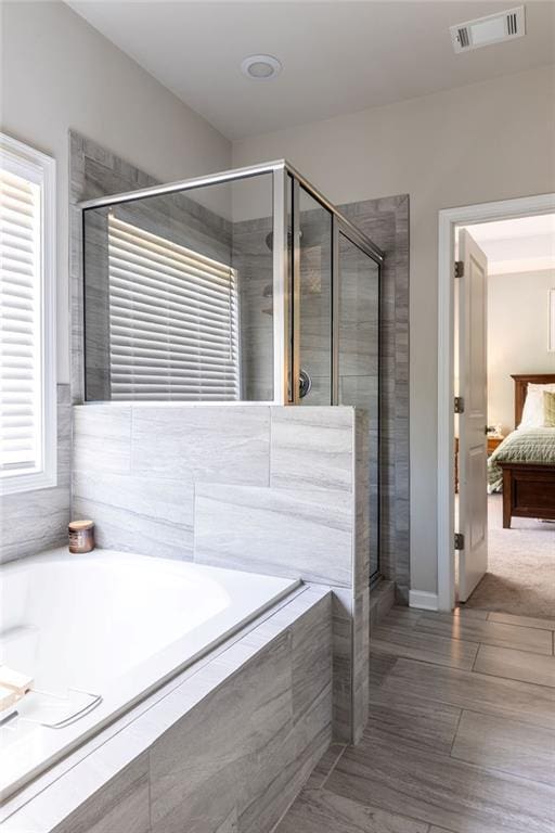2099 Lakeview Bend Way, Buford, GA 30519 - ensuite bathroom featuring a bath and a stall shower