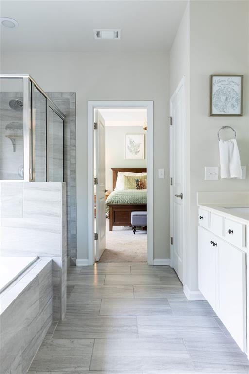 2099 Lakeview Bend Way, Buford, GA 30519 - ensuite bathroom with a stall shower, vanity, and a garden tub