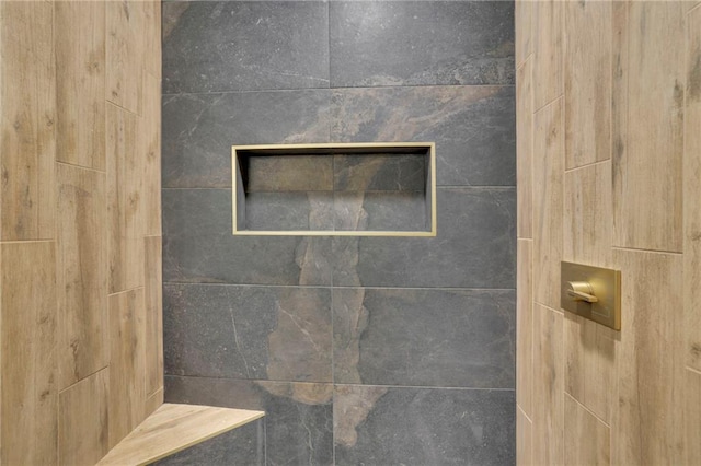 room details with a tile shower