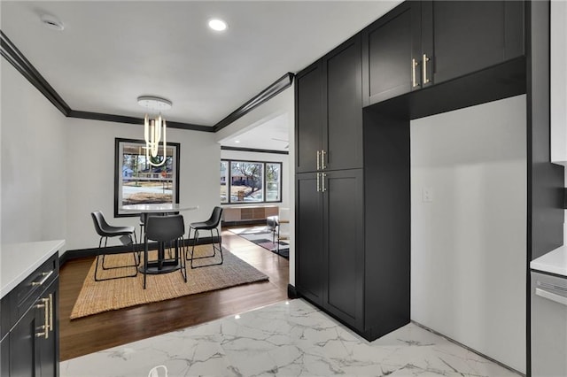 kitchen with hanging light fixtures and crown molding