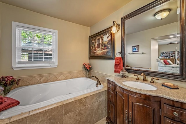 bathroom featuring vanity and a bath