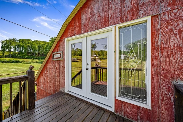 exterior space featuring a yard and french doors
