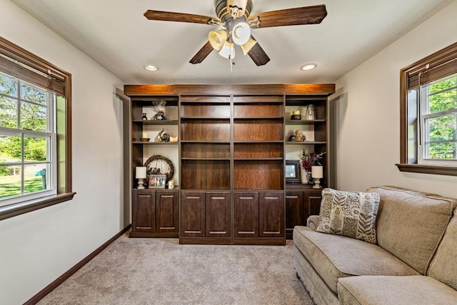 sitting room with ceiling fan, light carpet, baseboards, and recessed lighting