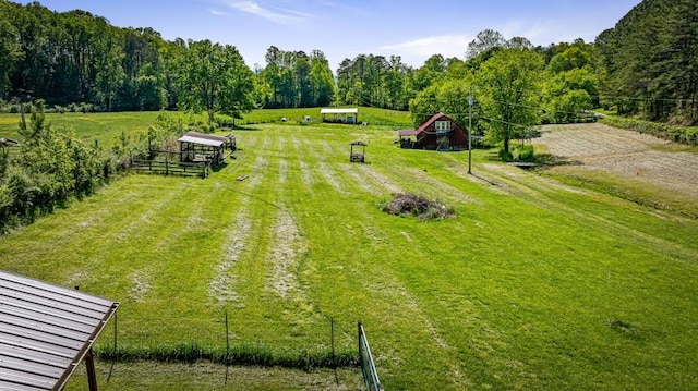 drone / aerial view featuring a rural view and a forest view