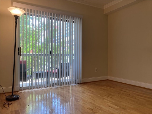 1075 Peachtree Walk Unit A205, Atlanta, GA 30309 - spare room featuring crown molding and wood finished floors