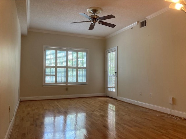 1075 Peachtree Walk Unit A205, Atlanta, GA 30309 - unfurnished room with ceiling fan, wood finished floors, ornamental molding, and a textured ceiling