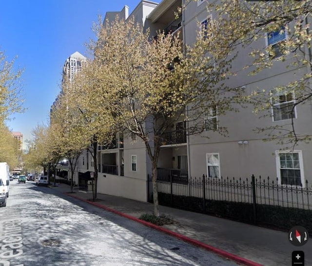 1075 Peachtree Walk Unit A205, Atlanta, GA 30309 - view of asphalt street with curbs and sidewalks