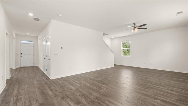 unfurnished living room featuring dark wood-style flooring, ceiling fan, baseboards, and recessed lighting