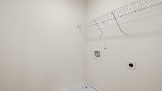 laundry room featuring washer hookup, electric dryer hookup, and baseboards