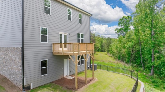 back of property with central air condition unit and a wooden deck