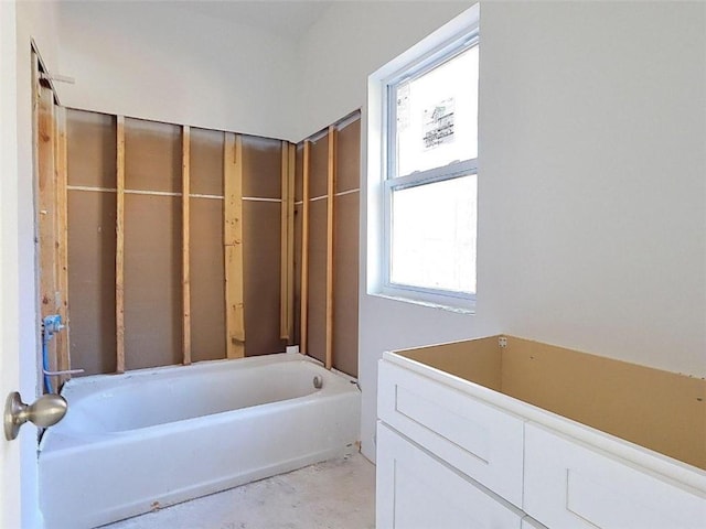 bathroom featuring a tub and concrete flooring