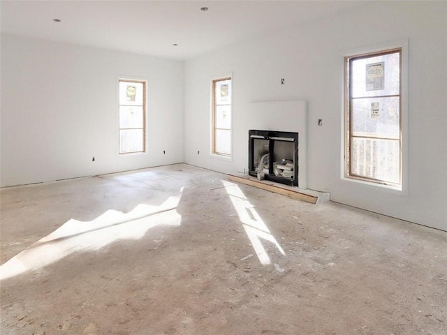 unfurnished living room with a healthy amount of sunlight