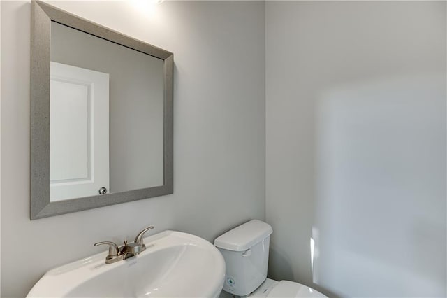 bathroom with a sink and toilet