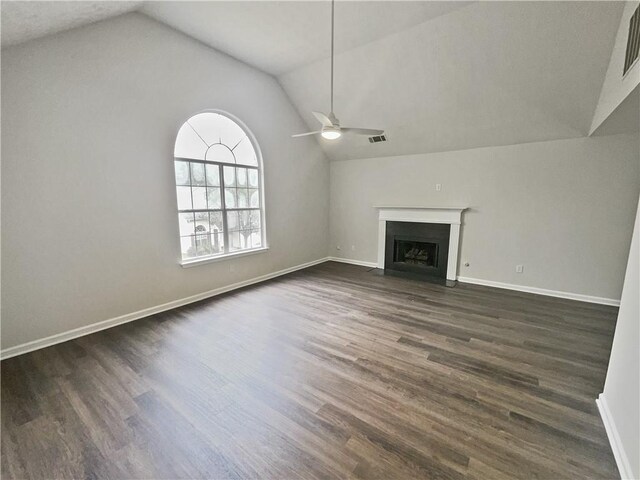 unfurnished living room featuring ceiling fan, lofted ceiling, and dark wood-type flooring