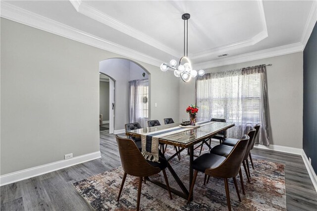 4850 Wilshire Xing, Cumming, GA 30040 - dining space with a raised ceiling, arched walkways, dark wood-type flooring, baseboards, and crown molding