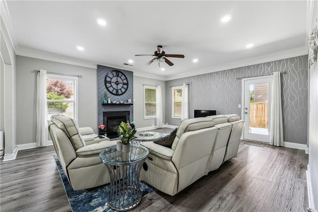 4850 Wilshire Xing, Cumming, GA 30040 - living room featuring ornamental molding, baseboards, a ceiling fan, dark wood-style floors, and a large fireplace