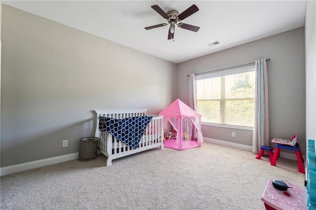 4850 Wilshire Xing, Cumming, GA 30040 - carpeted bedroom featuring baseboards, a nursery area, and ceiling fan