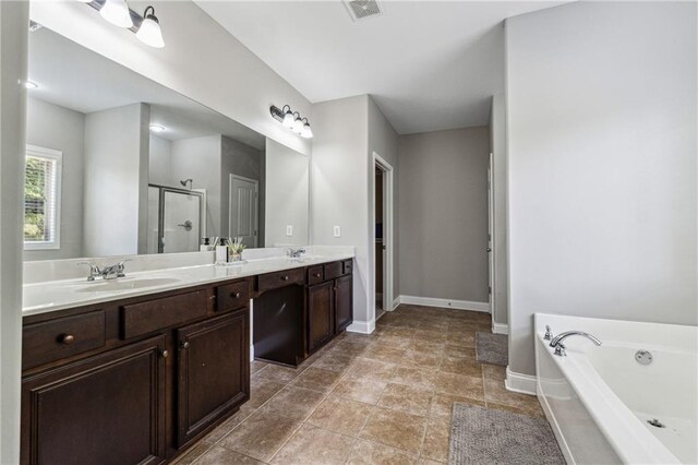 4850 Wilshire Xing, Cumming, GA 30040 - bathroom featuring a bath, a shower stall, baseboards, and double vanity