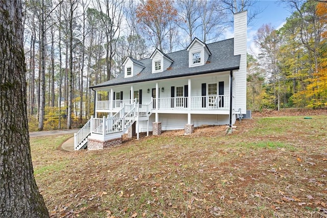 cape cod house with a porch and central air condition unit