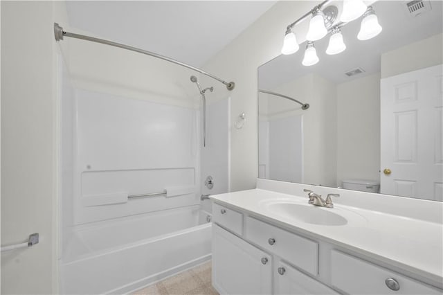 bathroom with visible vents, toilet, vanity, and shower / bathing tub combination