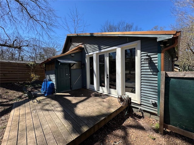 exterior space with french doors and fence