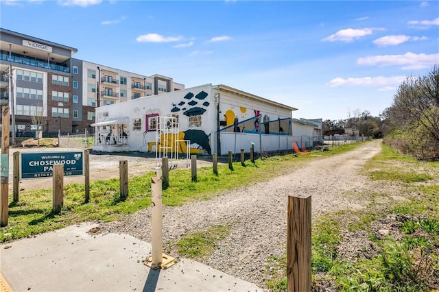 view of property's community featuring fence