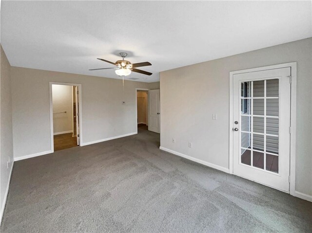 532 Terrapin Ln, Winder, GA 30680 - empty room featuring ceiling fan, dark carpet, and baseboards