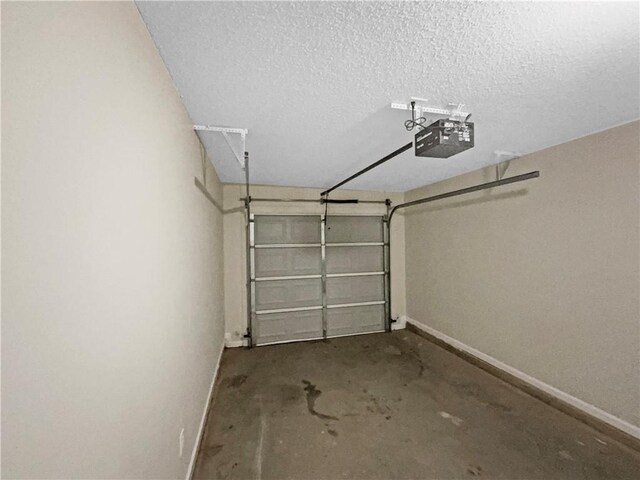 532 Terrapin Ln, Winder, GA 30680 - garage featuring baseboards and a garage door opener