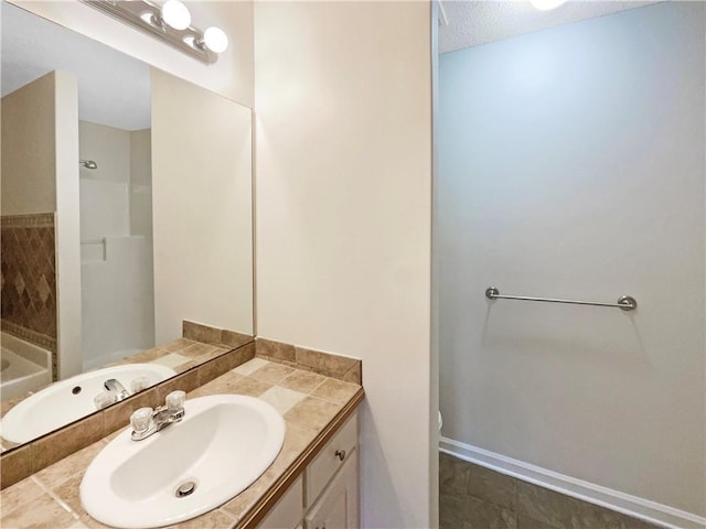 532 Terrapin Ln, Winder, GA 30680 - bathroom with toilet, baseboards, a textured ceiling, and vanity