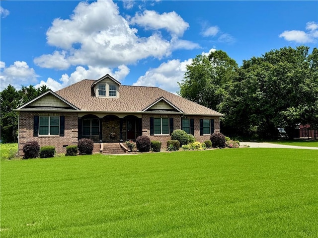 167 Techview Dr SW, Calhoun, GA 30701 - view of front of home featuring a porch, brick siding, and a front lawn