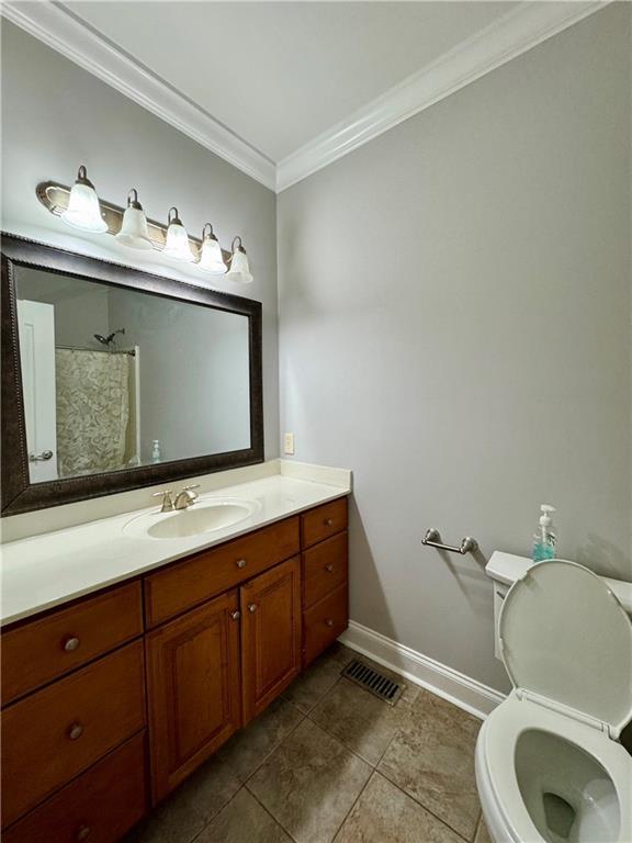 167 Techview Dr SW, Calhoun, GA 30701 - bathroom with baseboards, crown molding, tile patterned flooring, vanity, and a shower