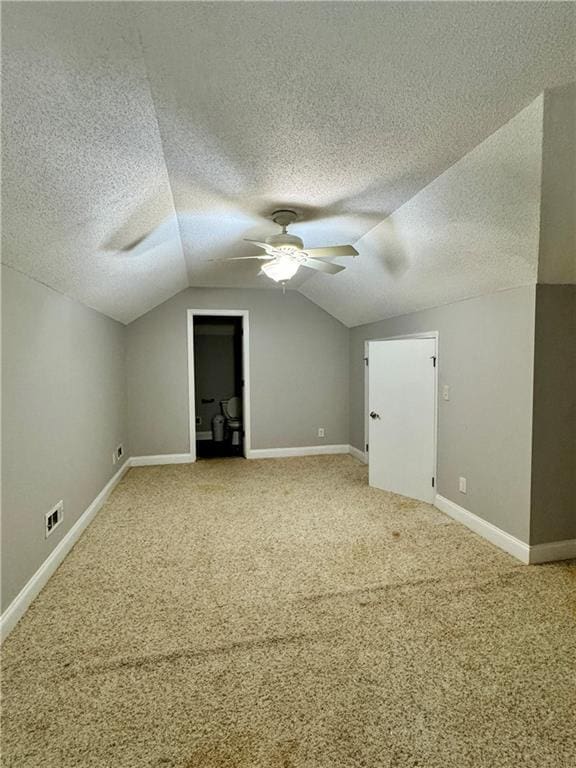 167 Techview Dr SW, Calhoun, GA 30701 - bonus room featuring a ceiling fan, lofted ceiling, carpet floors, a textured ceiling, and baseboards