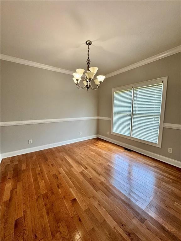 167 Techview Dr SW, Calhoun, GA 30701 - empty room with a chandelier, hardwood / wood-style floors, ornamental molding, and baseboards