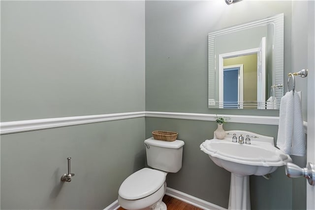 168 Eagle Pointe Dr, Dahlonega, GA 30533 - half bathroom featuring toilet, baseboards, and wood finished floors