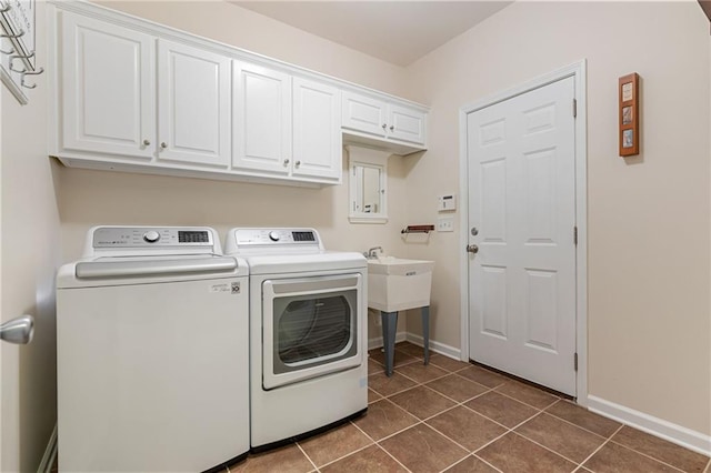 168 Eagle Pointe Dr, Dahlonega, GA 30533 - washroom with washing machine and clothes dryer, cabinet space, dark tile patterned flooring, and baseboards