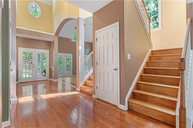 168 Eagle Pointe Dr, Dahlonega, GA 30533 - entryway featuring stairway, french doors, hardwood / wood-style flooring, baseboards, and a high ceiling