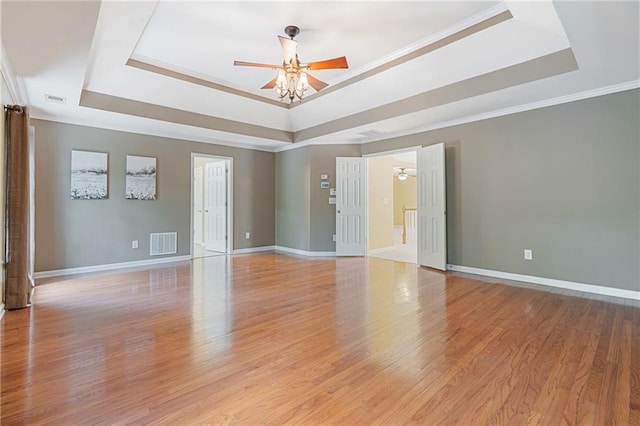 168 Eagle Pointe Dr, Dahlonega, GA 30533 - empty room featuring a tray ceiling, a ceiling fan, baseboards, and crown molding
