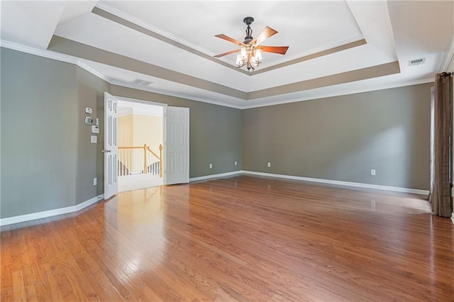 168 Eagle Pointe Dr, Dahlonega, GA 30533 - unfurnished room with a raised ceiling, light wood-type flooring, crown molding, ceiling fan, and baseboards