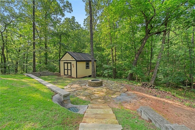 168 Eagle Pointe Dr, Dahlonega, GA 30533 - view of shed with an outdoor fire pit and a forest view