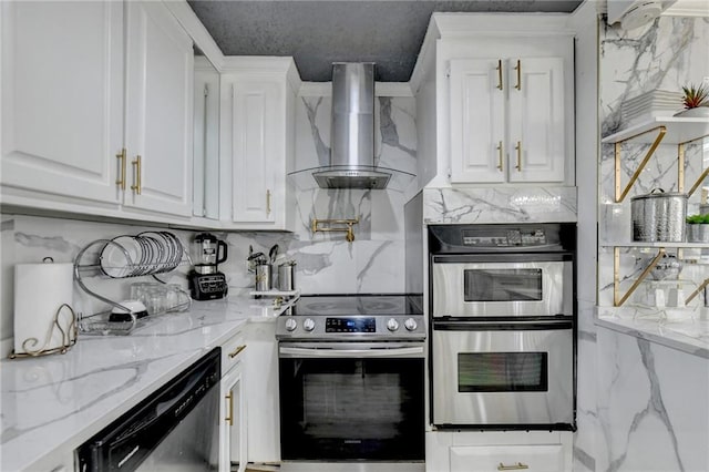 kitchen with wall chimney range hood, decorative backsplash, light stone counters, white cabinetry, and stainless steel appliances