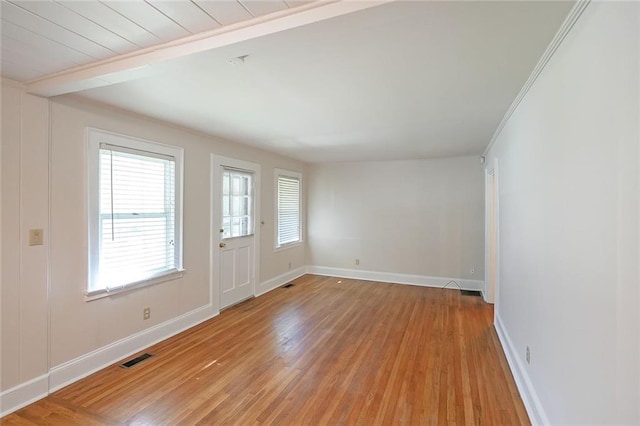 2055 Anderson Dr SE, Smyrna, GA 30080 - spare room featuring light wood-style floors, baseboards, and beamed ceiling