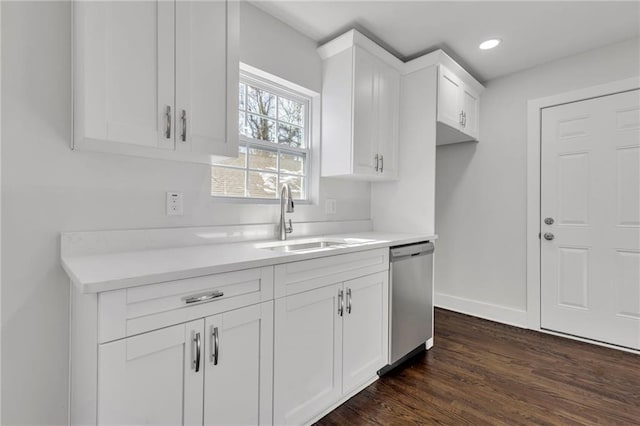 1271 Lorenzo Dr SW, Atlanta, GA 30310 - kitchen featuring dishwasher, a sink, dark wood-type flooring, white cabinetry, and light countertops