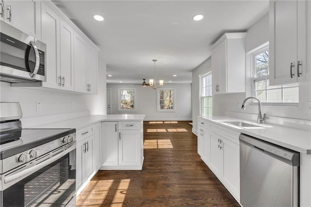 1271 Lorenzo Dr SW, Atlanta, GA 30310 - kitchen with stainless steel appliances, a sink, recessed lighting, plenty of natural light, and white cabinetry