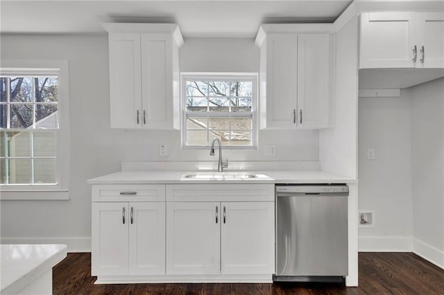 1271 Lorenzo Dr SW, Atlanta, GA 30310 - kitchen featuring dishwasher, a sink, white cabinetry, and baseboards