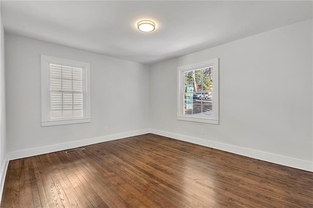 1271 Lorenzo Dr SW, Atlanta, GA 30310 - empty room featuring baseboards and dark wood-style floors