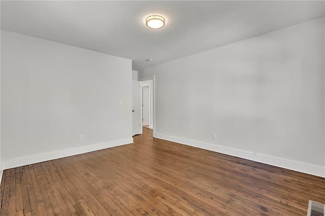 1271 Lorenzo Dr SW, Atlanta, GA 30310 - unfurnished room with baseboards and dark wood-type flooring