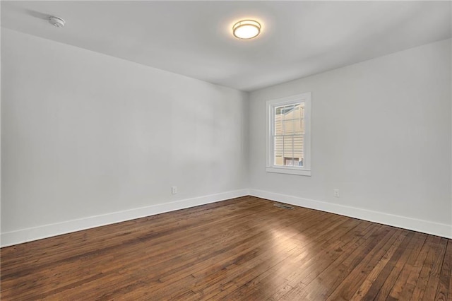 1271 Lorenzo Dr SW, Atlanta, GA 30310 - unfurnished room featuring dark wood-style floors, baseboards, and a smoke detector