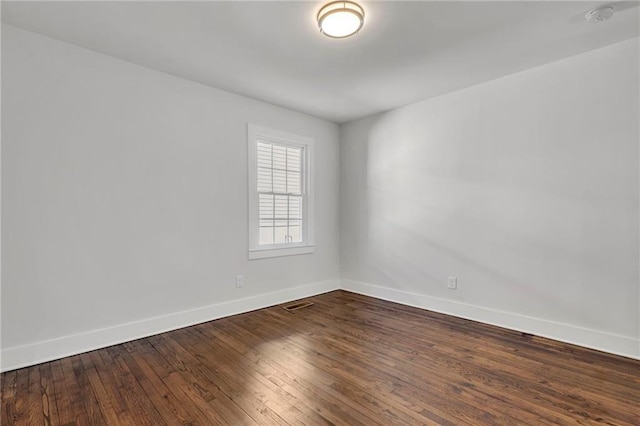 1271 Lorenzo Dr SW, Atlanta, GA 30310 - empty room with baseboards, a smoke detector, and dark wood-style floors
