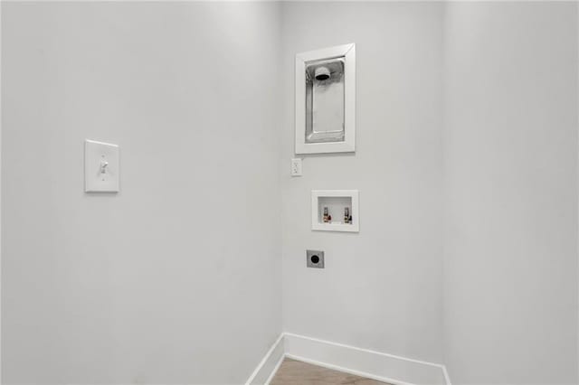 1271 Lorenzo Dr SW, Atlanta, GA 30310 - laundry area featuring electric dryer hookup, washer hookup, baseboards, and wood finished floors