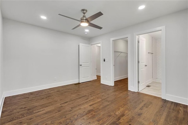 1271 Lorenzo Dr SW, Atlanta, GA 30310 - unfurnished bedroom featuring wood finished floors, a spacious closet, baseboards, a closet, and ensuite bathroom